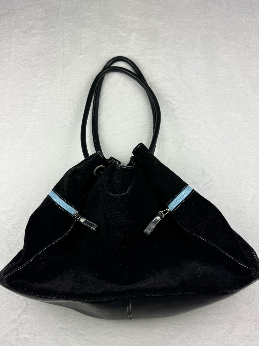 Cole Haan suede hobo bag in black, characterized by its slouchy silhouette
